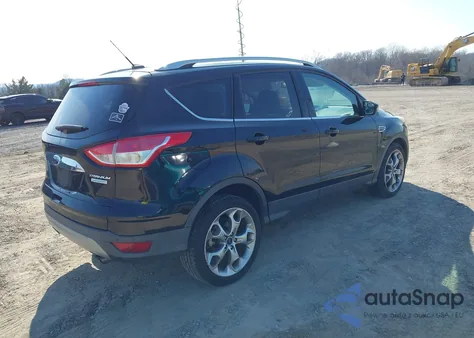 2016 Ford Escape Titanium z USA, uszkodzony, nr VIN 1FMCU0JX6GUC64657